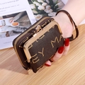 Deep brown faux leather wallet with wrist strap and gold metal clasp on a wooden desk - M-Print Brown