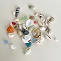 Mix of natural sea shells and sea glass fragments in white, blue, and green tones - Mini Sea Shells 100g (No Box)