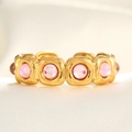 Macro detail of gold vintage ring with square frames and pink synthetic opal stones - Adjustable Open / 18K Gold Pink Translucent Stone