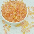 Macro detail of high-quality gradient glass beads with gold foil inside for DIY jewelry - 6mm / 6mm Yellow Pink Gradient