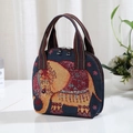 Ethnic small handbag with embroidered colorful elephant patterns and striped handle - Red Yellow Elephant