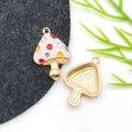 Detailed view of pink enamel mushroom charms with gold metal plating for DIY jewelry making - Drip Oil Colored Dots Pink Mushroom