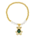 Detail of beaded bracelet with gold teddy bear pendant and green heart gemstone - Green