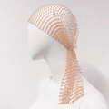 Detailed view of champagne mesh headscarf with shimmering rhinestones for party styling - Nude