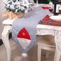 Grey felt Christmas table runner featuring red gnome decorations on a festive white table - Grey Forest Man Style