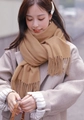 Soft camel cashmere scarf with elegant fringe detail worn by a model in winter - Cationic Viscose Style / 200x70cm / Camel