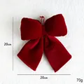 Luxurious 20cm red velvet Christmas bow pendant with golden cord for festive home decor - Medium Bow