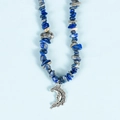 Irregular blue lapis lazuli stone necklace featuring a silver crescent moon face pendant - Lapis Lazuli Moon