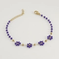 Elegante pulsera de acero dorado 18K con cuentas de flores en cristal púrpura - Pulsera / Azul