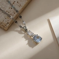 Elegant silver necklace featuring two clear zircon cherry pendants on a fine metal chain - Silver Vertical Double Stone Style