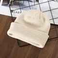 Beige ribbed knit beanie cap for men and women featuring a thick casual warm winter style - Beige