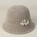 Close-up of beige crochet sun hat with hollow texture, pearl accents and flower details - S (56-57cm) / Gray