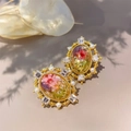 Macro detail of vintage 18K gold earrings with dried flowers, pearls and crystals - Pink Dandelion