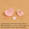 Close-up of three translucent pink resin gold ingots in small, medium, and large sizes - Luminous Pink