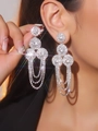 Luxurious silver tassel earrings with geometric discs and sparkling crystals on model - Silver Geometric Disc Fringe