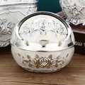 White and silver horse ashtray with rose carvings on wooden surface with a book - Silver White Rose Enamel