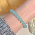 Sky blue crystal beaded bracelet with faceted beads on a woman wrist close-up view - Sky Blue Translucent Round Bead (MY37994)