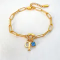 Elegante 14K vergulde roestvrijstalen schakelarmband met initiaal en blauwe edelsteen - Letter Q / Staalkleur