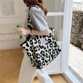 Close-up of leopard print canvas tote bag with woven label and spacious design - Large Capacity Shoulder Tote Bag