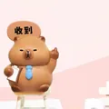 Resin Capybara office figurine wearing a blue tie and holding a file folder - Wolf Culture Capybara (3087) / Ornament Series