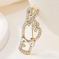 Golden gesture hand brooch with colorful rhinestones and a crystal bowknot accessory - Iridescent V-Sign Bow (YNCP6273)