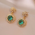 Elegant gold flower drop earrings with emerald green stones and white cubic zirconia accents - Emerald Green Floral Design (E0535)