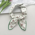 Floral cotton linen neck scarf with red flowers and green borders in a stylish knot - Green Edge Floral
