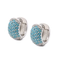 Detail view of mini round silver huggie earrings with sky blue pavé turquoise stones - Silver with Turquoise