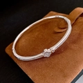 Silver finish clover bracelet with pavé cubic zirconia on a brown suede jewelry pouch - 4# Silver Clover