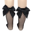 Close-up of black mesh fishnet socks with a large bow detail on a mannequin leg - One Size (Parent-Child) / Black Fishnet / Black Bow