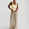 Chic Y2K yellow halter neck tank top paired with beige linen trousers for women - S / Yellow