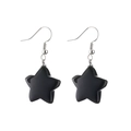 Close-up of black star pendant earrings with silver hooks on a clean white background - Black Rhinestone Star