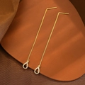 Macro detail of gold-plated tassel earrings with zircon-inlaid waterdrop pendants - Light Gold Zirconia