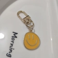 Golden alloy keychain with a yellow enamel smiley face pendant for bags and accessories - Large Single Yellow