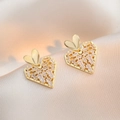 Elegant gold heart earrings with white cubic zirconia on champagne silk background - Gold Double Heart Style (E0467)