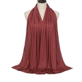 Solid rust red modal cotton hijab with elastic texture and soft drape on mannequin - Jujube Red