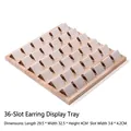 Detailed view of 36-slot wooden earring display tray with beige microfiber inserts - 36 Slots Earring Rack