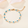 Detail of 18K gold plated evil eye bracelet with blue enamel beads and lobster clasp - Light Blue