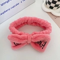 Pink coral fleece headband with OMG embroidery and bow for skincare and makeup - Watermelon red