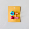 Detail of colorful flower and round bead hair clips for girls on display card - Blue