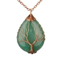 Macro detail of hand-wrapped copper wire Tree of Life on a green crystal drop pendant - Aventurine Bronze