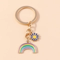 Portachiavi arcobaleno e margherita con ciondoli in smalto dorato per borse - Margherita Blu