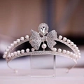Macro detail of silver baroque bridal tiara with rhinestones and pearl bow details - No.6 Silver (White Stone)