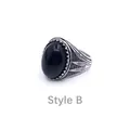 Macro shot of Style B vintage men's ring with black gemstone and leaf textured details - US 8 / Style B