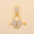 Close-up of a gold-plated heart pendant pierced by an arrow with crystal rhinestones - Gold Heart Lock (Crown)