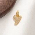 Macro view of gold pendant featuring micro-pave zircons on a textured leather surface - Letter Y