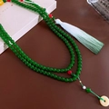Long green ceramic beaded necklace with pale green tassel and safety buckle pendant - Green/Tassel Safety Buckle