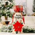 Linen Christmas wine bottle cover with plaid trim and a 3D red poinsettia flower - Red Poinsettia