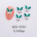Macro shot of 9.5x9mm green gemstone and pearl butterfly nail art studs with silver base - Green Pearl Silver Base Style (MZH-9794)