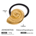 Close-up of golden stainless steel nautilus hair tie showing detailed metallic texture - Gold Nautilus